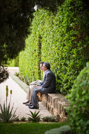 Two delegates sit in the gardens