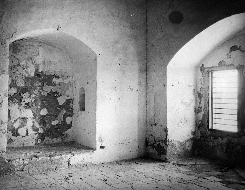 This 1921 photo shows the prison cell in which Bahaâuâllah was kept for more than two years from 1868 to 1870. It was here where he revealed some of the messages to the kings and rulers of the world.
