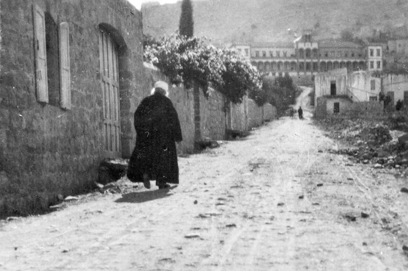 This 1920 photo shows âAbduâl-Baha walking from His house on Haparsim Street in Haifa. He worked tirelessly to promote peace and to tend to the safety and well-being of the people of Akka and Haifa.